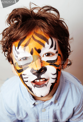 Image of little cute boy with faceart on birthday party close up, little 