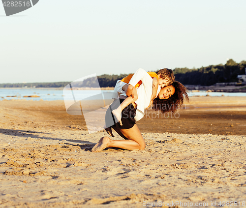 Image of pretty diverse nation and age friends on sea coast having fun, lifestyle people concept on beach vacations close up