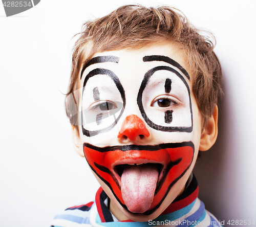 Image of little cute boy with facepaint like clown, pantomimic expression