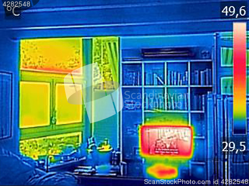 Image of Infrared thermovision image showing heated TV and a window in th