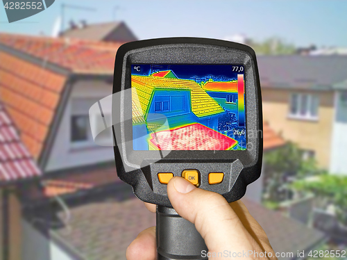 Image of Recording Warmed roofs on family homes with thermal camera