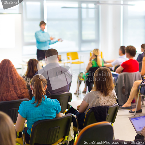 Image of Speaker at Business convention and Presentation.