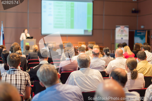 Image of Speaker giving presentation on business conference.