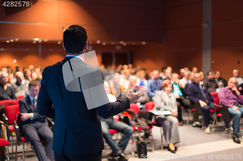 Image of Speaker at Business Conference and Presentation.