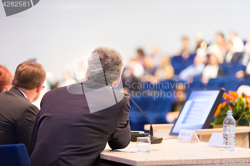 Image of Speaker at Business Conference and Presentation.