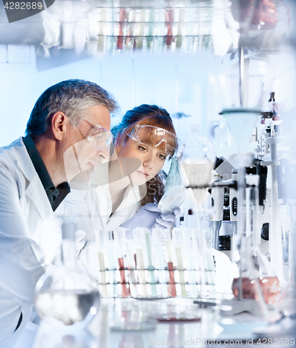 Image of Health care researchers working in scientific laboratory.