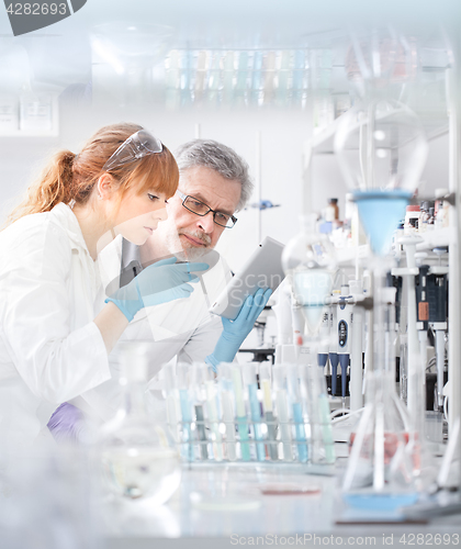 Image of Health care researchers working in scientific laboratory.