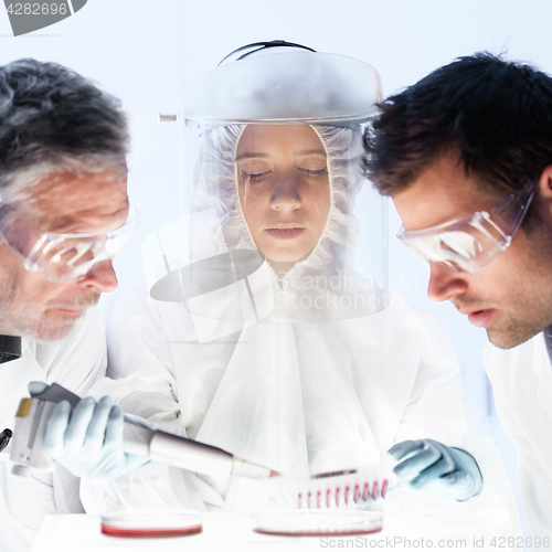 Image of Health care researchers working in scientific laboratory.