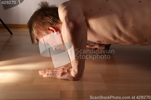 Image of Man doing pushups