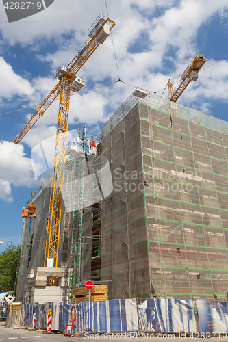 Image of Building facade renovation, house reconstruction, repair.