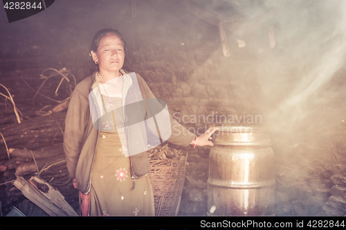 Image of Woman in green dress in Nepal