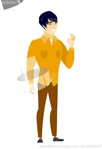 Image of Smiling businessman showing ok sign.