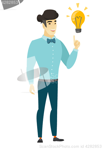 Image of Businessman pointing at business idea light bulb.