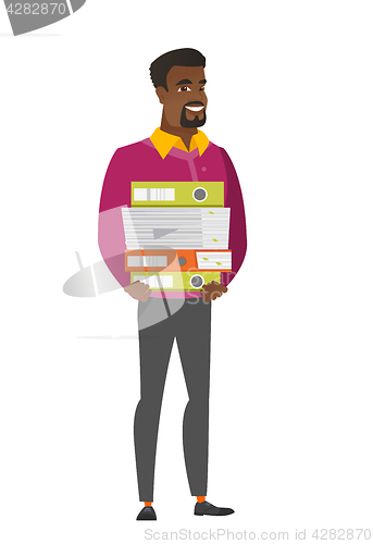 Image of Businessman holding pile of folders.