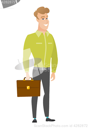 Image of Caucasian business man holding briefcase.