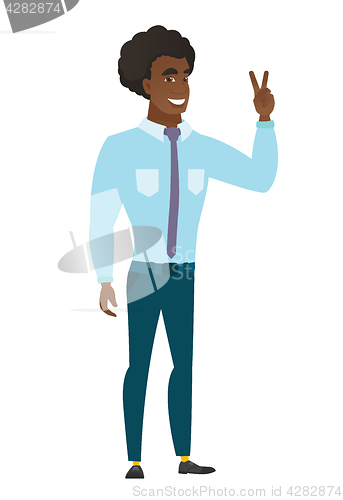 Image of Caucasian businessman showing the victory gesture.