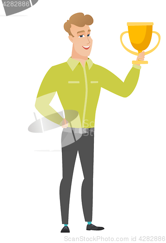 Image of Caucasian business man holding a trophy.