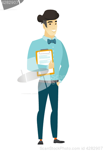 Image of Businessman holding clipboard with documents.