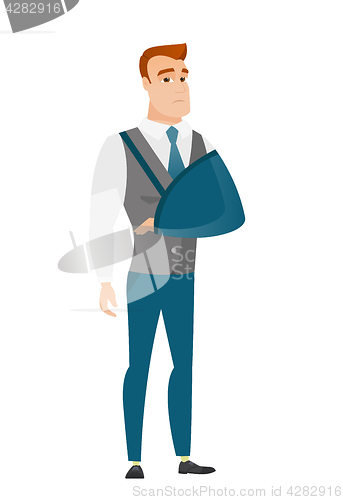 Image of Injured businessman with broken arm.