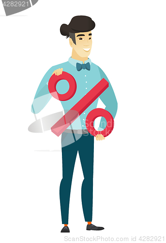 Image of Smiling businessman holding percent sign.