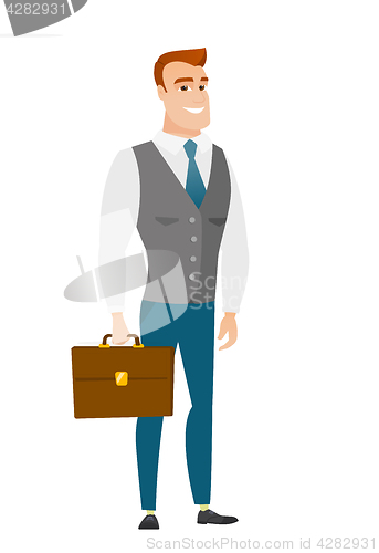 Image of Caucasian business man holding briefcase.