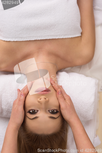 Image of woman receiving a head massage