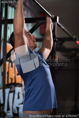 Image of man doing pull ups