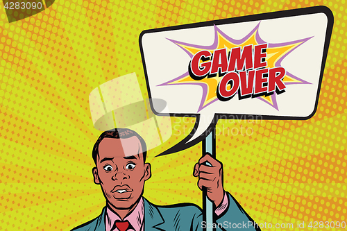 Image of African protester businessman with a poster game over