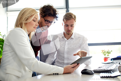 Image of business team with tablet pc at office