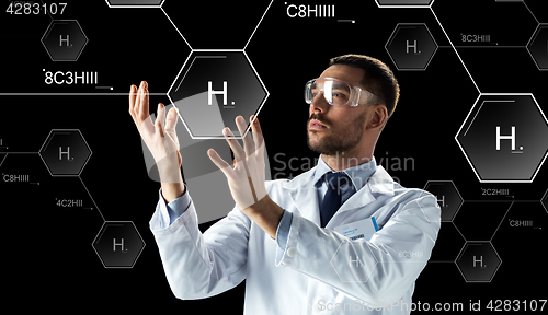 Image of scientist in lab goggles chemical formula