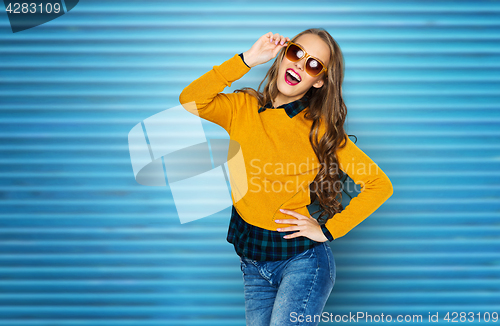 Image of happy young woman or teen girl in casual clothes