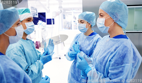 Image of group of surgeons in operating room at hospital