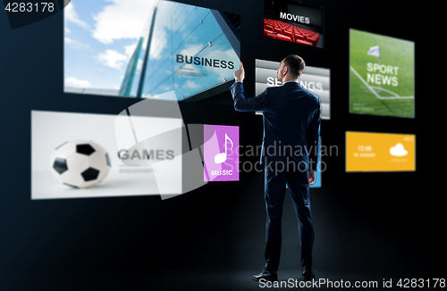 Image of businessman working with virtual applications