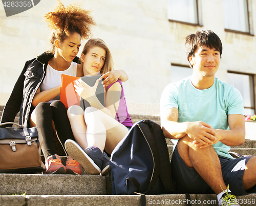 Image of cute group teenages at the building of university