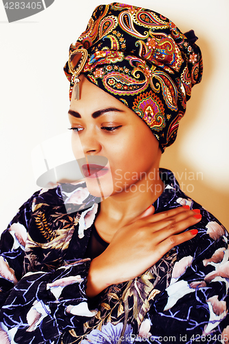 Image of beauty bright african woman with creative make up, shawl on head