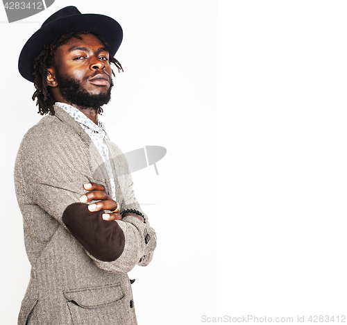 Image of young handsome afro american boy in stylish hipster hat gesturin