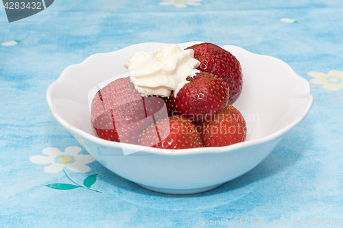 Image of Strawberries with whipped cream dessert