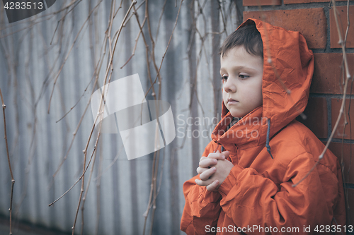 Image of Portrait of sad little boy