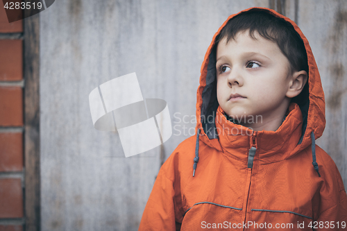 Image of Portrait of sad little boy