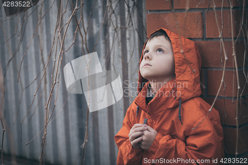 Image of Portrait of sad little boy