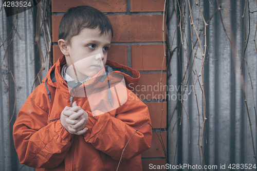 Image of Portrait of sad little boy