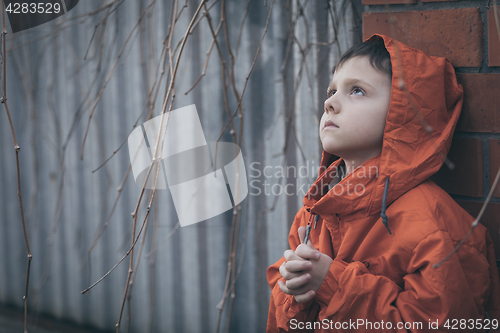 Image of Portrait of sad little boy