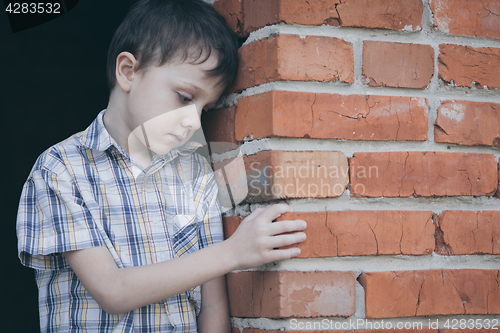 Image of Portrait of sad little boy