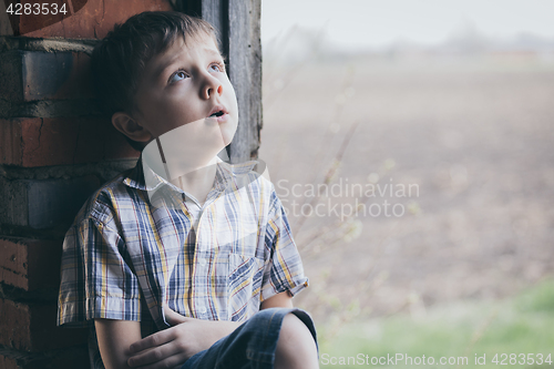 Image of Portrait of sad little boy