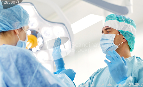 Image of surgeons in operating room at hospital