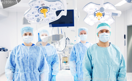 Image of group of surgeons in operating room at hospital