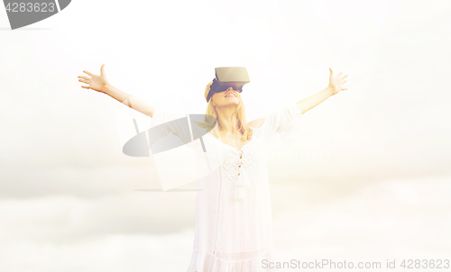 Image of woman in virtual reality headset outdoors