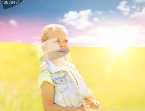 Image of happy little girl outdoors at summer