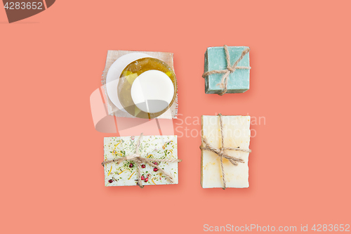 Image of handmade soap bars over pink background