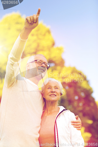 Image of senior couple hugging in park